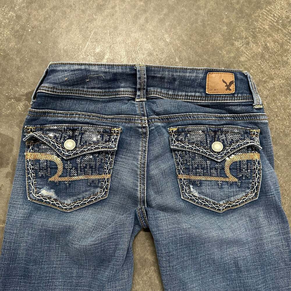 American Eagle Outfitters Flap Pocket Embellished Low-Rise Kick Bootcut Jeans - Picture 5 of 8